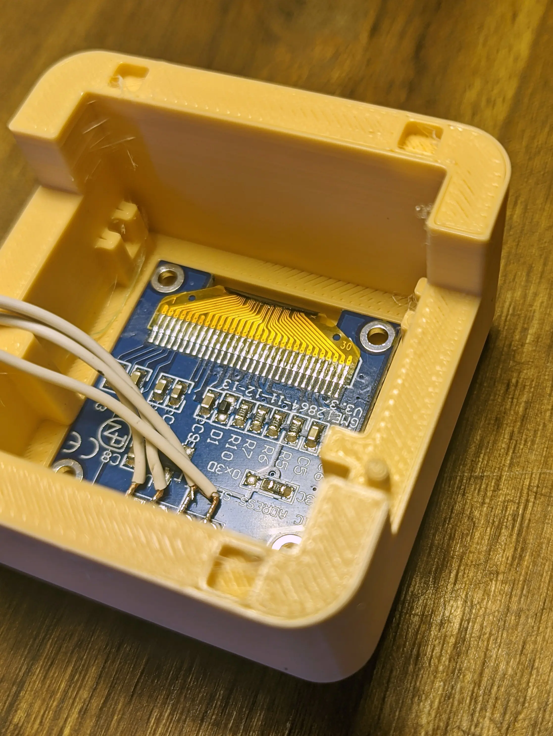Same camera shot as before, but the left hand side of the display board has been pressed down to slot into the front recess.