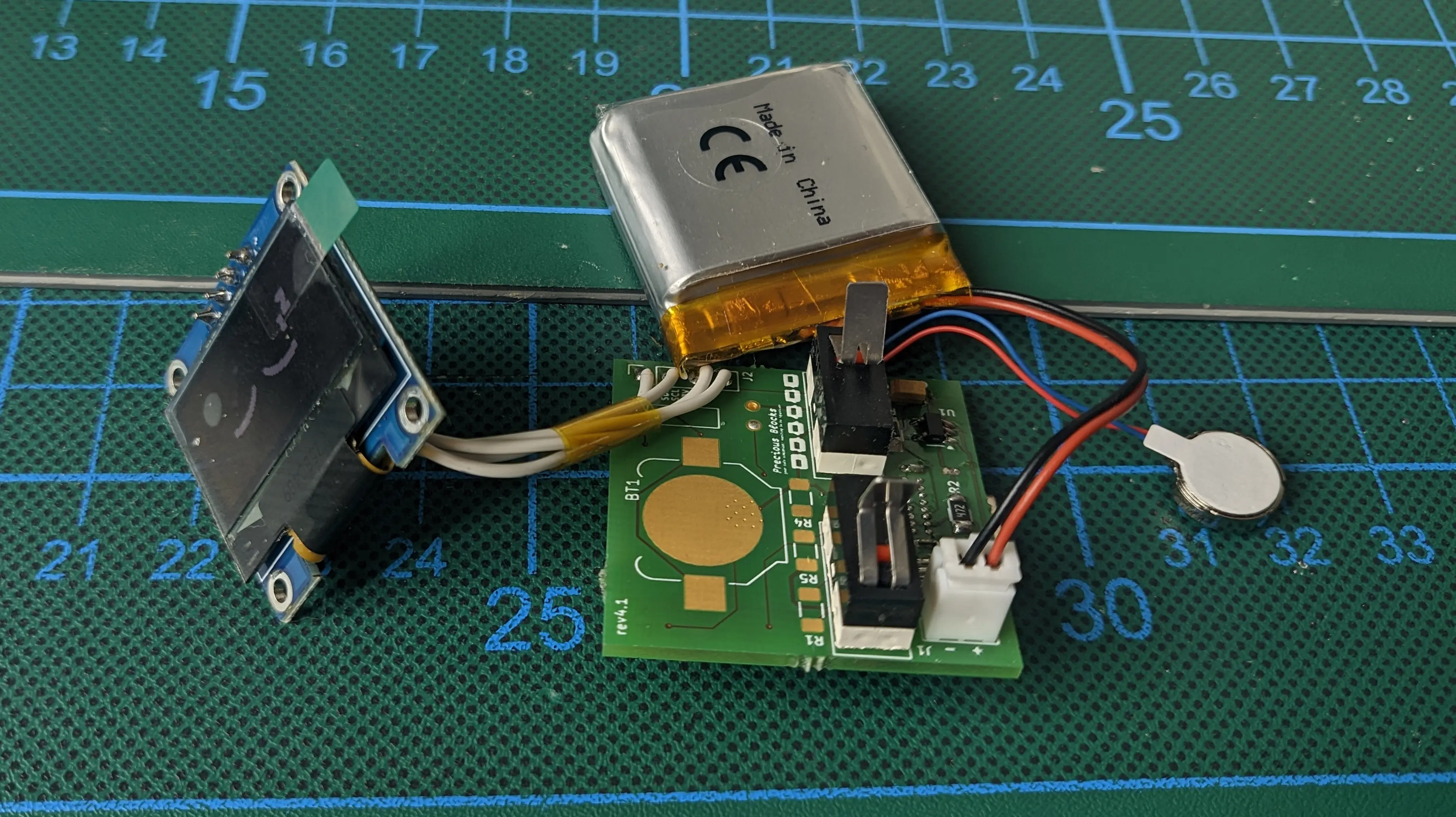 Precious Block PCB with the required components installed. Some copper plates are still unpopulated, but the battery has been connected and the motor and display wires soldered to the pins on the PCB.