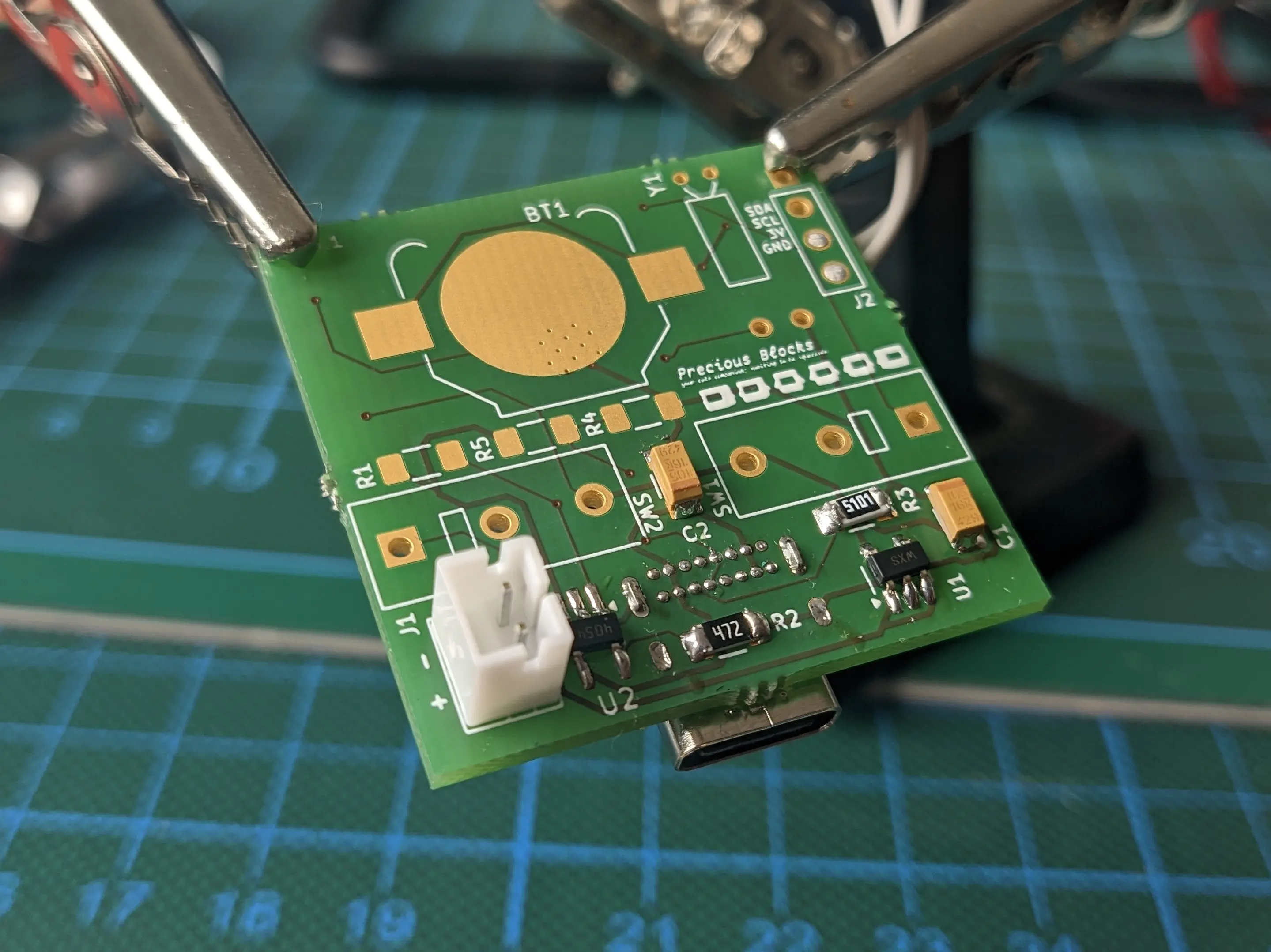 Other side of the PCB, with a battery connector and small chips installed